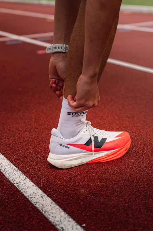 STRYDE SMOOTH white anti-blister running socks worn on a run